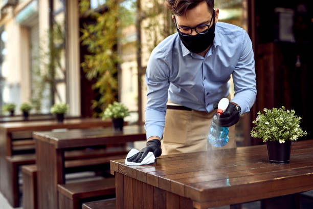 waiter cleaning during pandemic
